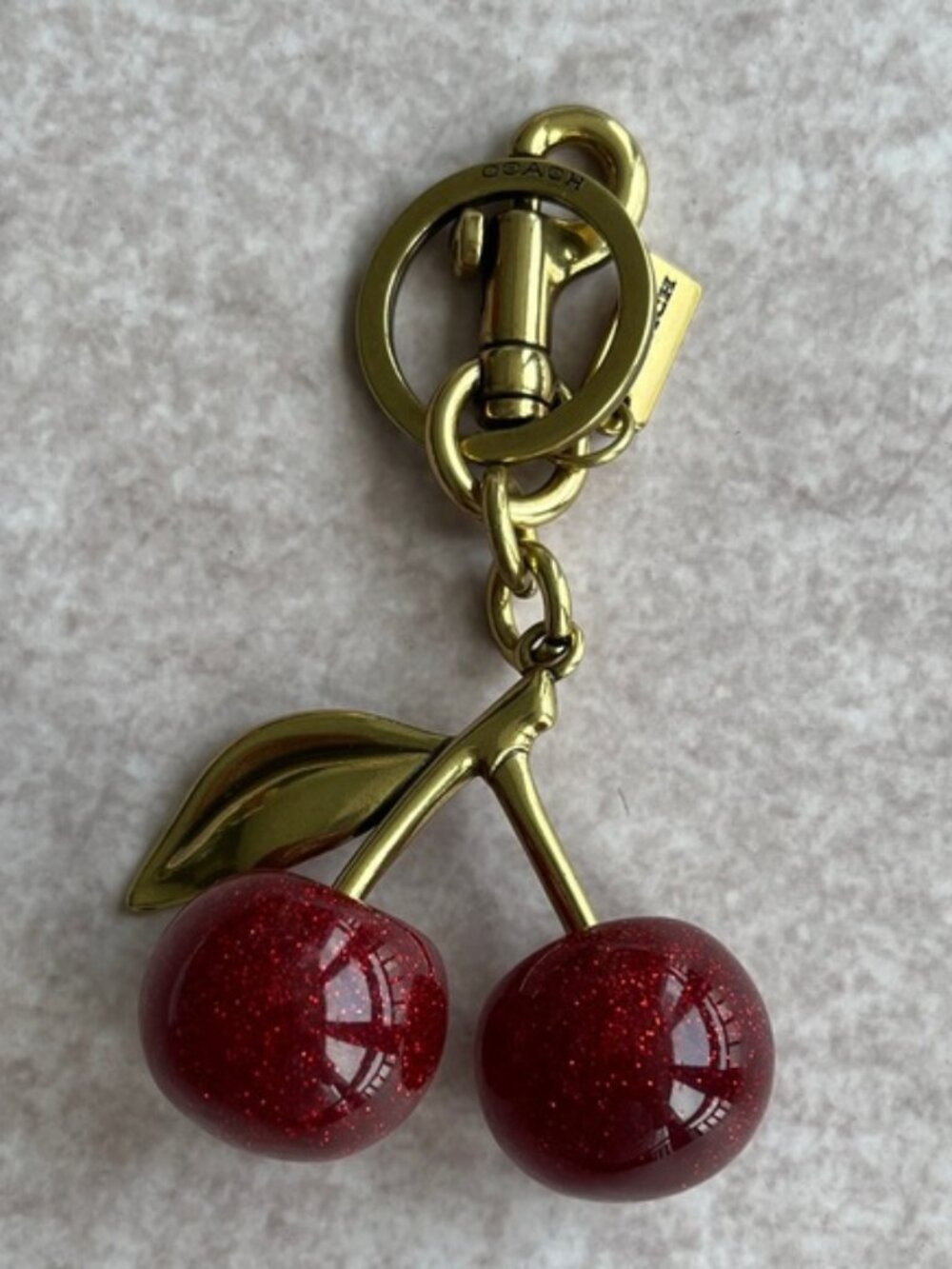 Coach Gold-Tone Cherry Key Charm with Red Glitter